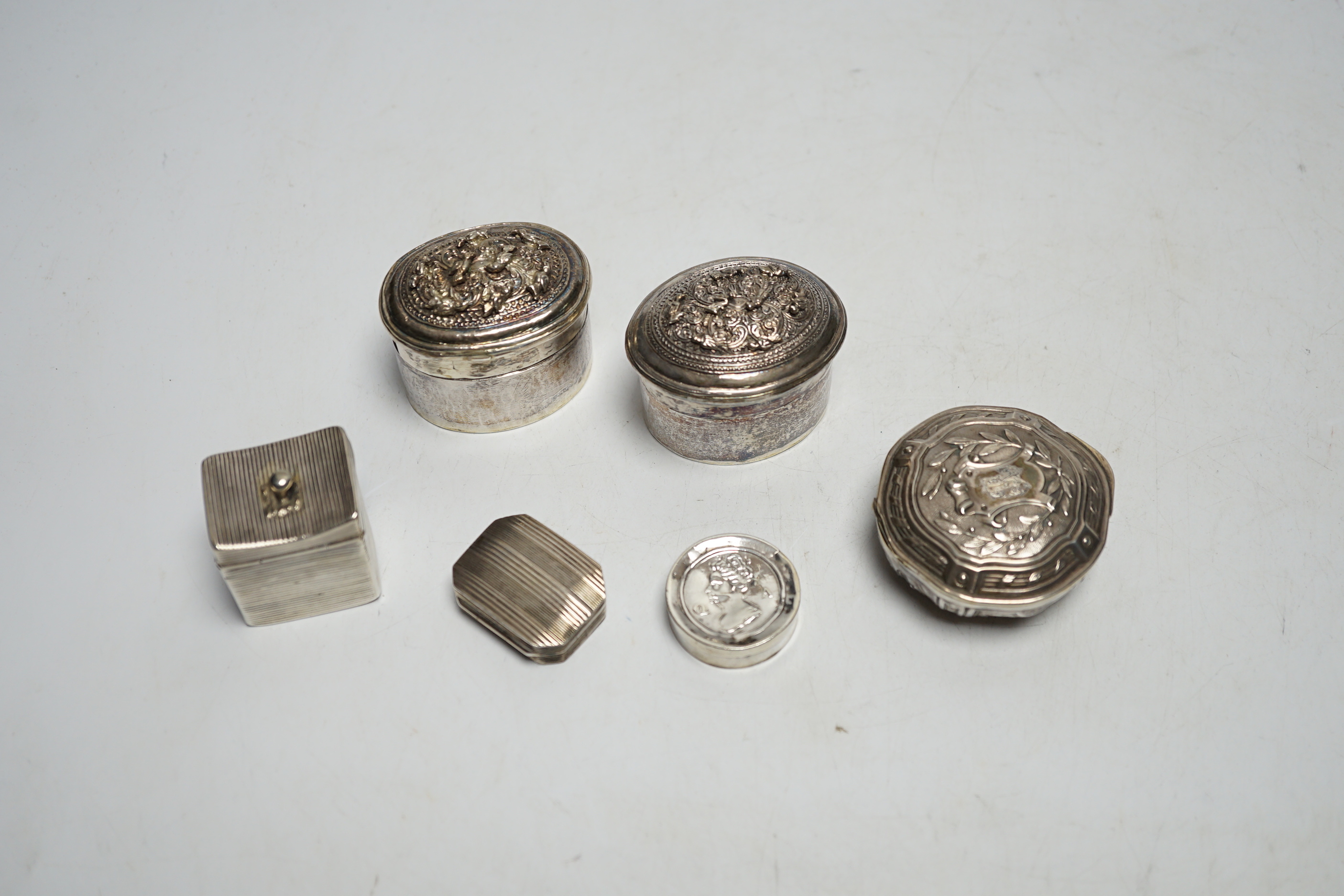 Assorted silver and white metal pill boxes, including Dutch, together with a 19th century vinaigrette by Samuel Pemberton, 30mm.